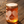 Jar of honey with a decorative label on a wooden surface
